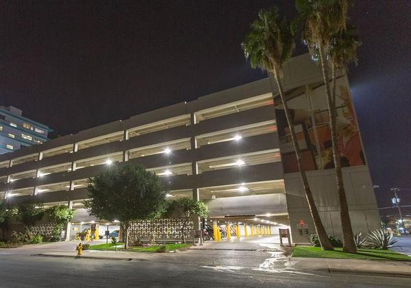 The U-Haul corporate office in Phoenix from the outside shown with bright parking garage lighting